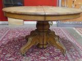 a wooden table with a wooden top on a rug