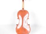 an old violin sitting on a white surface with a white background