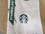 a starbucks bag with a starbucks logo on it