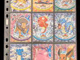 pokemon trading cards are displayed on a binder with a black background