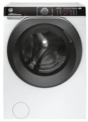 une machine à laver blanche posée sur un comptoir blanc