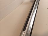 a metal rail that is attached to the side of a wall
