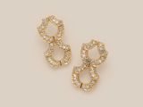 a pair of gold and diamond earrings on a white background