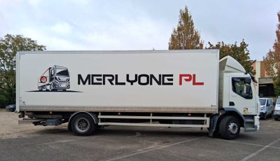 a white truck that is parked in a parking lot