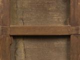 a picture of an old wooden door with a sign on it