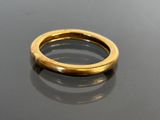 an image of a gold ring sitting on top of a table