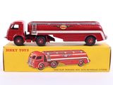 a red toy truck that is on top of a box