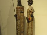 two statues that are on display on a table