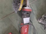a red tool on the floor next to a red tool box