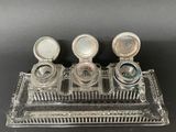 an image of a glass tray with three different types of perfumes
