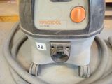 a machine that is sitting on the floor with a hose