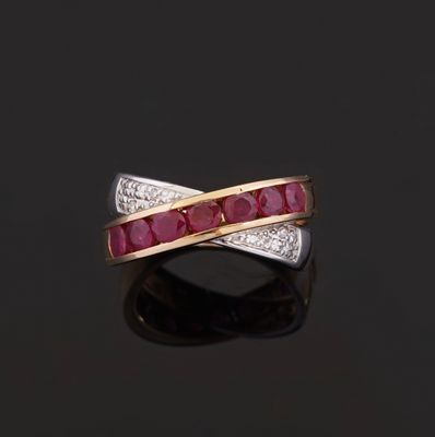 a ruby and diamond crossover ring