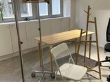 a room with a desk and a chair in it