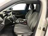 the interior of a white car with grey seats and a steering wheel