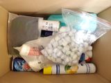 a box full of medicine and other items in it