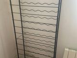 a rack that has a bunch of wine bottles on it