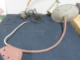 a picture of a table with a lamp and some other items