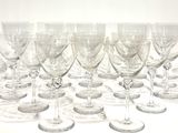 a lot of wine glasses sitting on a table