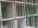many shelves that have been built into the side of a building