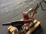 a small machine that is sitting on top of a pallet
