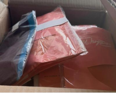a box full of clothes and a pair of flip flops