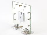 a glass clock that is on display on the table