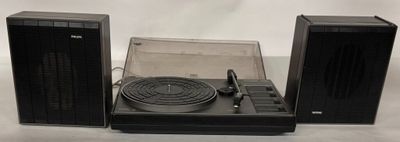 a turntable with a record player and speakers on it