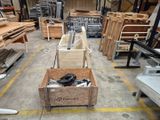 a wooden crate filled with wood planks in a warehouse