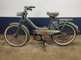 a blue and white bike parked in a garage