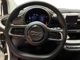 the interior of a car with a steering wheel and dashboard controls