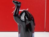 a black elephant figurine sitting on a table