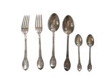 five silver spoons and two silver spoons on a white background