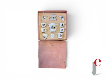 a box with a set of teapots and cups in it