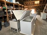 a white chest freezer sitting inside of a room