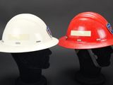 two hard hats are sitting side by side on a mannequin head