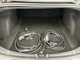 a trunk of a car with a bunch of wires in it