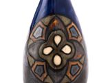 a blue vase with a design on it on a white background