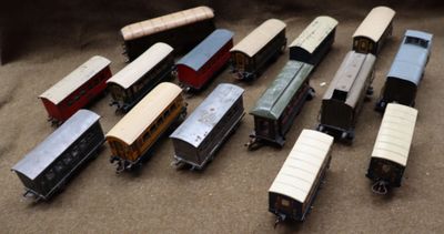 a lot of toy trains that are sitting on the floor