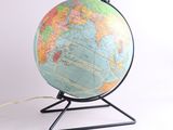 a globe that is on a stand with a cord