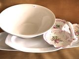 a white plate with a bowl on it and a plate with a bowl on it