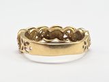 a close up of a gold ring on a white surface