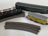 four toy trains that are sitting next to each other
