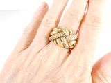 an image of a woman ' s hand with a gold ring on it