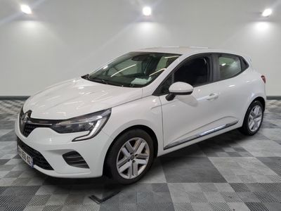 the white car is parked on a checkered tile floor