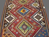 an old rug with many different colors and designs on it
