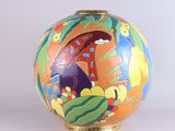 a colorful vase with a painting on it on a white surface
