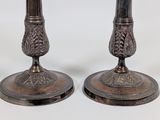 pair of silver plated candlesticks with floral design