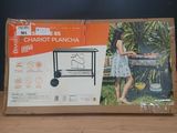 a cardboard box with a picture of a woman cooking on a grill