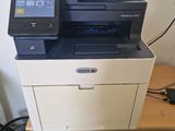 a printer that is sitting on top of a cabinet