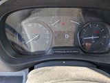 a close up of a car dashboard with a speedometer and gauges